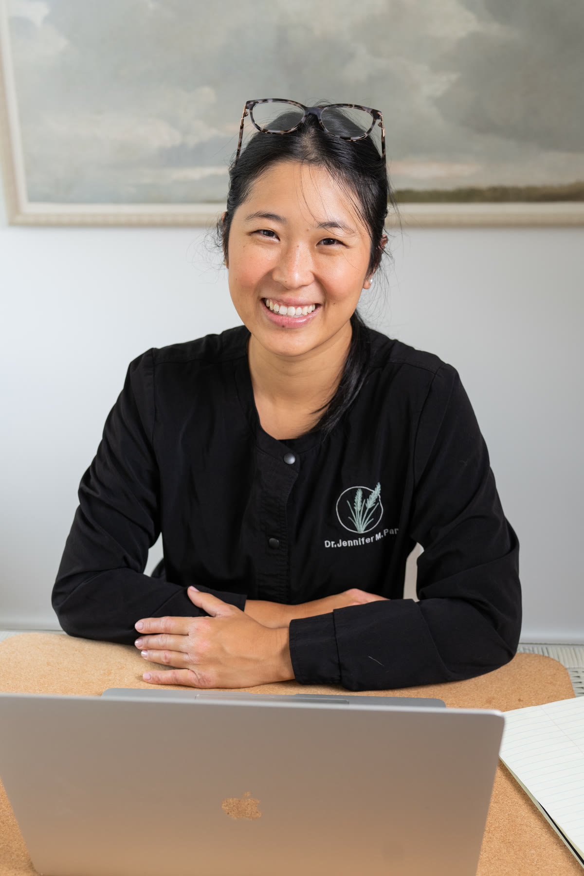 Dr. Jennifer Pan planning a case at her desk