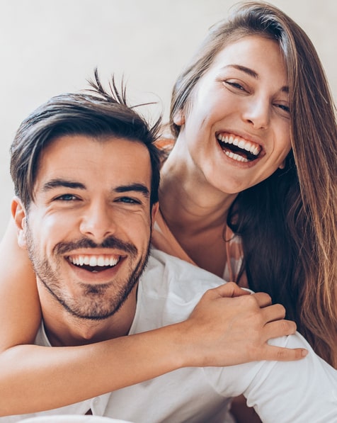couple-hugging-and-happily-smiling-on-the-white-background